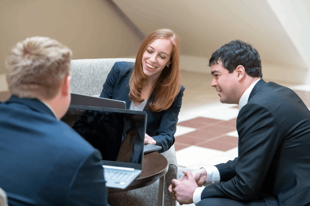 Marlene Goldenberg and Brett Vaughn, Attorneys and Partners at Nigh Goldenberg Raso & Vaughn PLLC, smiling while working."