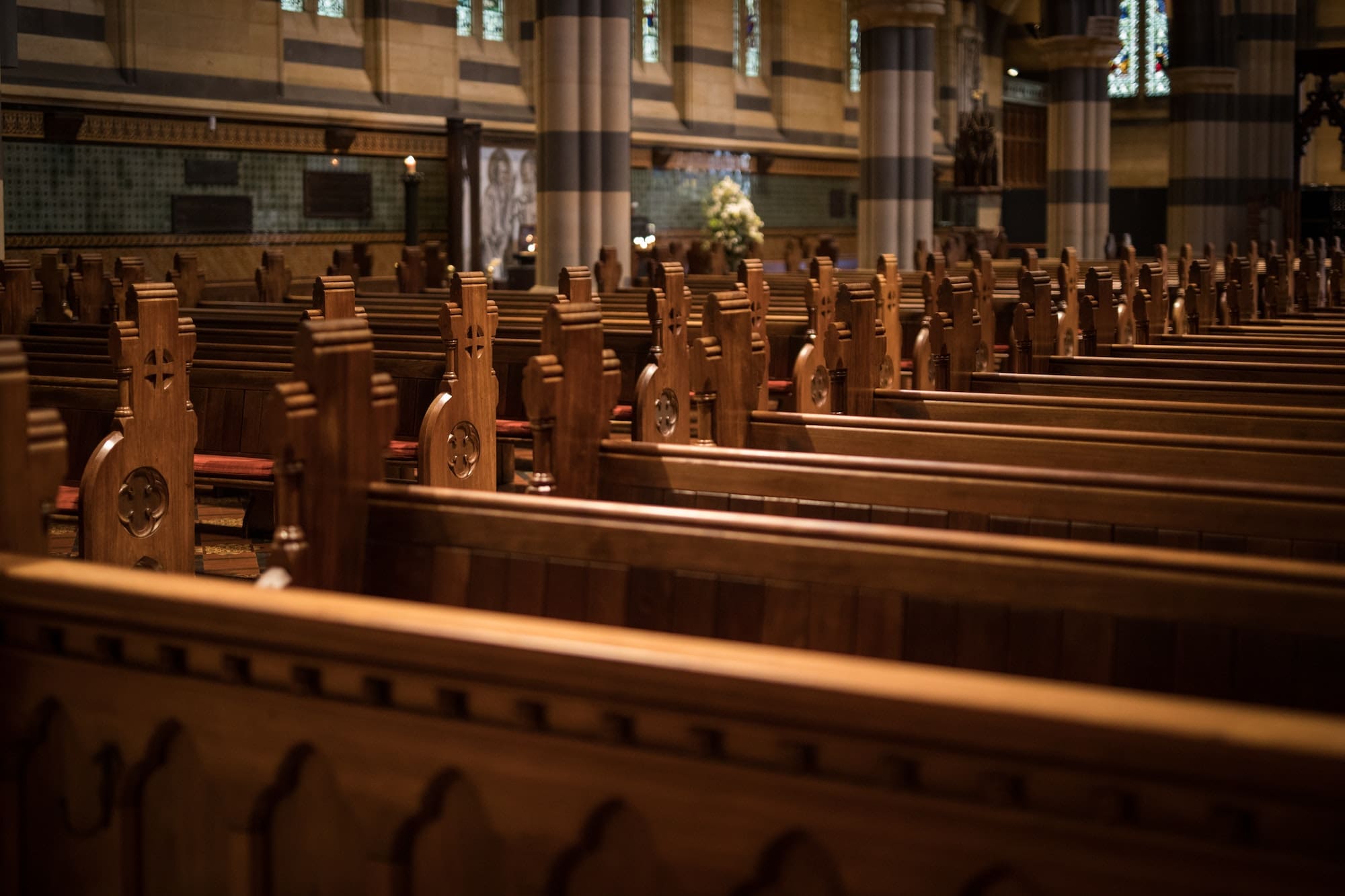 Empty church pews symbolizing the aftermath of the clergy sexual abuse scandal in Illinois