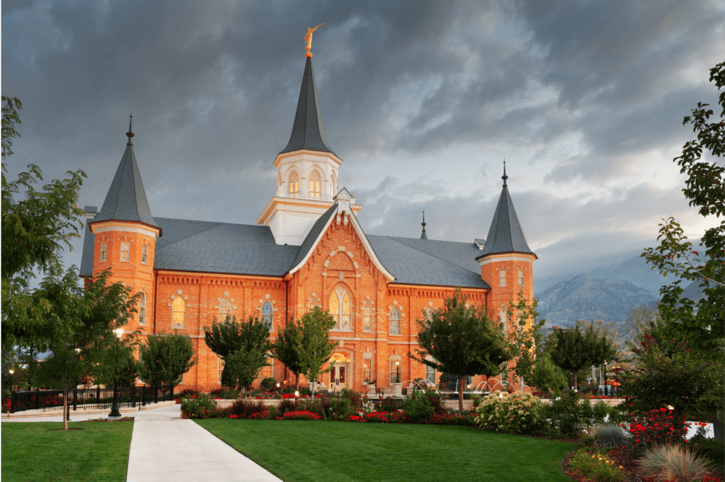 Mormon temple under a cloudy sky, representing the dark cloud of sexual abuse in the Mormon Church.