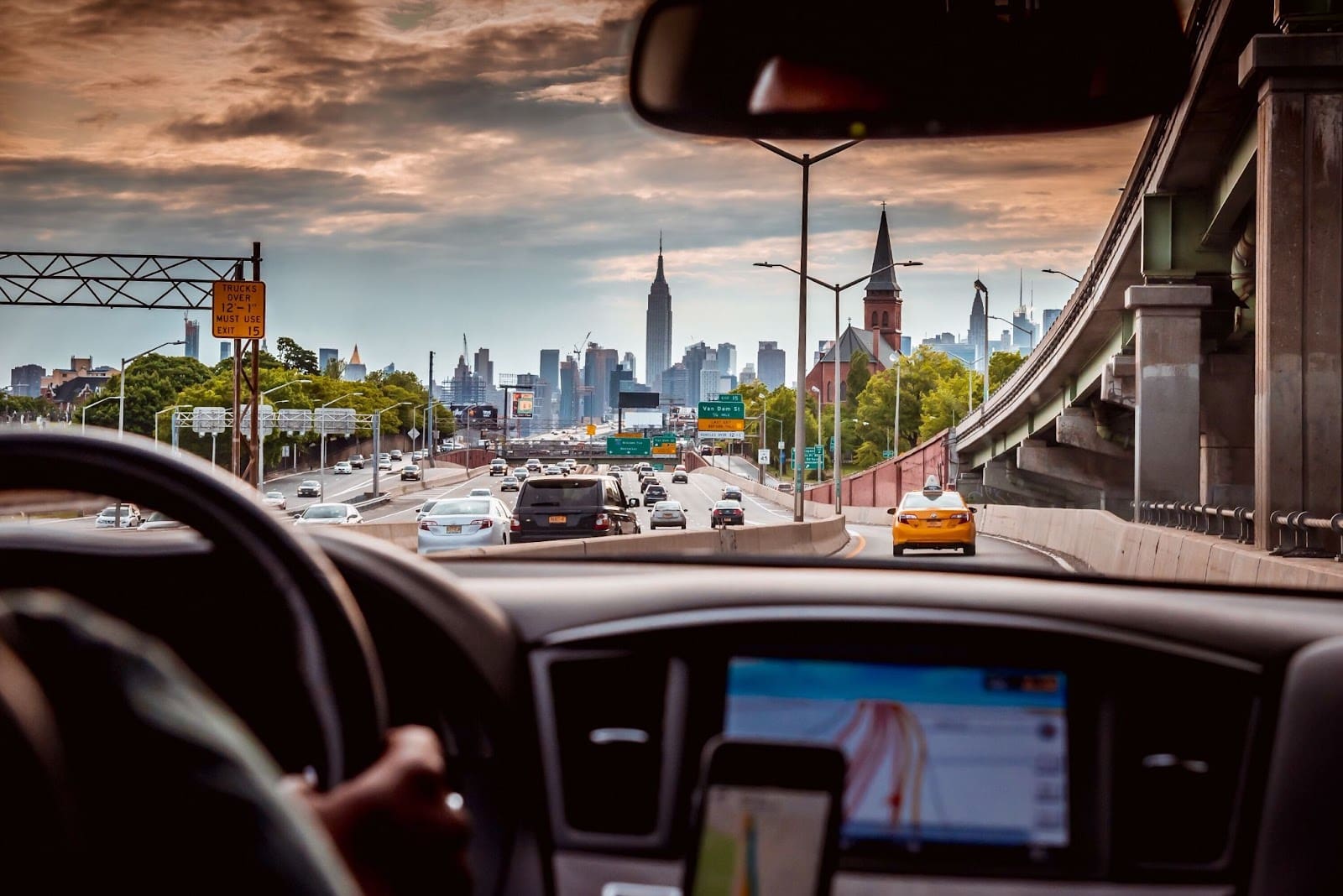Uber car interior with New York skyscrapers, reflecting Uber's legal challenges in rideshare industry.