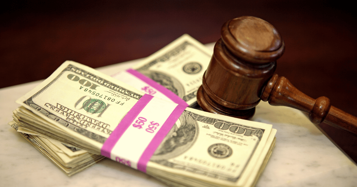 Legal settlement documents, tax forms, and gavel representing taxable and non-taxable lawsuit payments