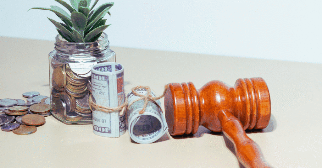 Gavel, legal papers, and calculator on a lawyer’s desk symbolizing liens, subrogation, and financial recovery in legal settlements.