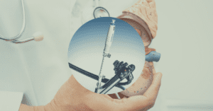 Microscopic view of an Olympus duodenoscope tip under 10X magnification showing contamination and design defects linked to 2025-2026 recalls.