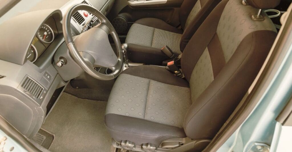 A professional close-up of a vehicle's electronic control module and safety sensors, representing automotive engineering litigation.