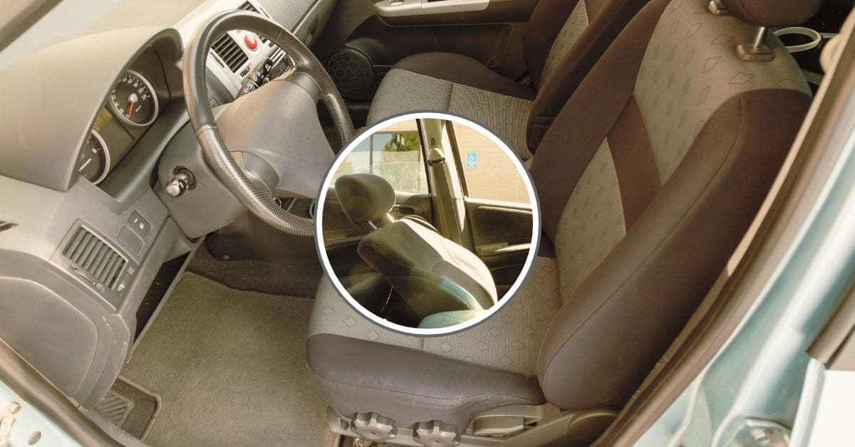 A vehicle interior showing a front driver's seat that has collapsed backward into the rear passenger space after a collision.