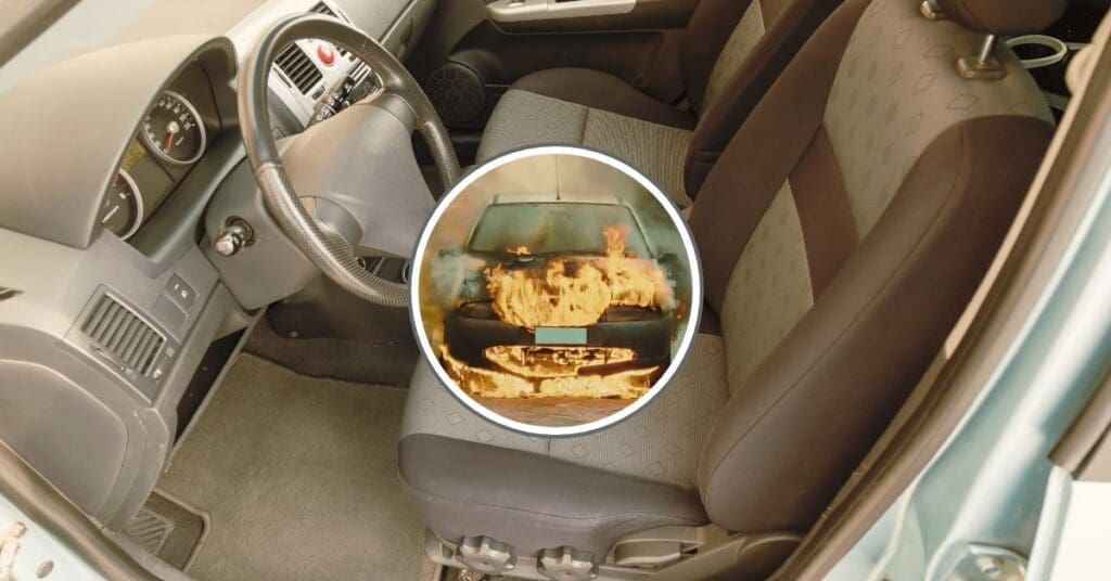 A charred vehicle interior showing the engine compartment and the firewall barrier, illustrating fire propagation and safety defects.