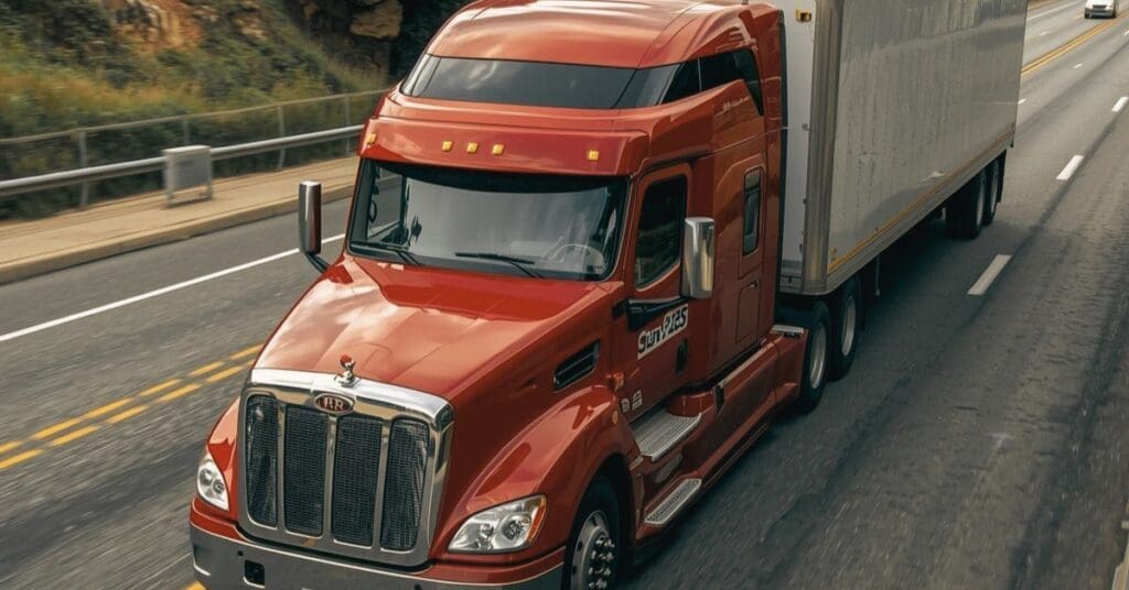 A commercial semi-truck navigating the I-295 Anacostia Freeway in Washington, D.C., representing trucking litigation and federal safety mandates.